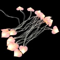 a bunch of lights that are in the shape of jellyfish on a black background