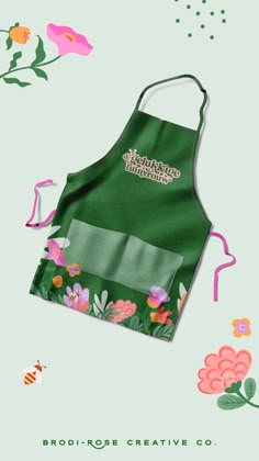 a green apron with flowers on it