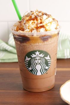 a starbucks drink with whipped cream and caramel on top