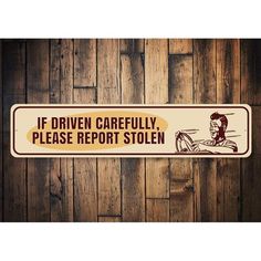 a sign that says if driven carefully, please report stolen on wood paneled wall