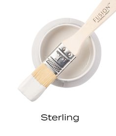 a white paint brush sitting on top of a bowl with the words sterling written below it