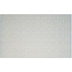 a white rug with an intricate design on the front and back side, in shades of blue