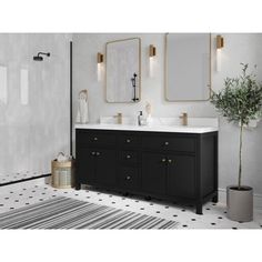 a bathroom with black and white tile flooring and two mirrors on the wall above the sink