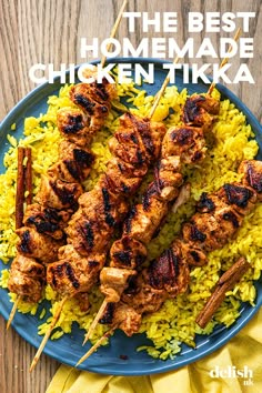 the best homemade chicken tikka served over rice on a blue plate with yellow napkin