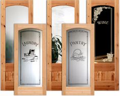 three doors with wine labels on them in front of a mirror and potted plant