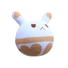 a white and brown stuffed animal with hearts on it's chest, sitting in front of a white background