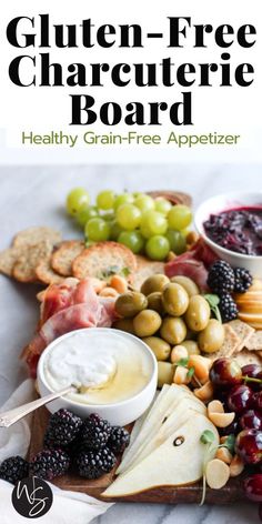 the gluten - free charcute board is loaded with fruit, cheese and crackers