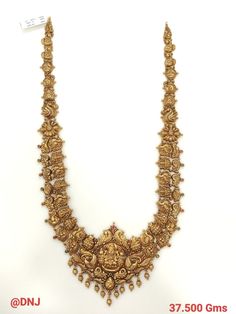 an elaborate gold necklace is displayed on a white background with the price tag for $ 3, 500