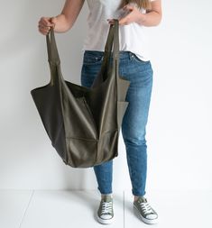 "Oversized Bag - Large Leather Tote Bag - XXL Handbag OVERSIZE STYLISH TOTE BAG made from high quality natural leather. Very roomy interior provides a lot of space for all the daily essentials and more. It is large enough to hold all your weekend essentials. This bag is a great option as your everyday bag. It can fit A4 files, books, magazines, cosmetic bag, accessories, your Macbook / Ipad and other electronic devides. Inside there are 2 pockets for mobile phone and another one with zipper for Dark Green Handbag, Weekend Essentials, Slouchy Tote, Large Hobo Bag, Large Leather Tote Bag, Large Handbag, Soft Leather Bag, Stylish Tote Bag, Green Handbag