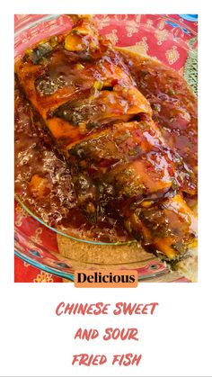 delicious chinese sweet and sour fried fish is served in a glass dish on a red tablecloth