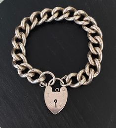 This beautiful vintage sterling silver curb link bracelet has 3/4 inch wide links and a beautiful heart padlock clasp which has London 1976 hallmarks. Bracelet measures 7 inches. There is not a safety chain but one could be added. Weighs 54.1 grams. Please go to my shop- Carter Jewelry22- for more fabulous antique and vintage pieces! Also follow me on Instagram at CarterJewelry. Chunky Silver Jewellery, Heart Padlocks, Safety Chain, Beautiful Heart, Vintage Pieces, Vintage Love, Silver Jewellery, Chain Link Bracelet, Cute Jewelry