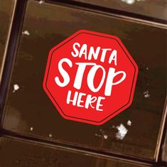 a sticker that says santa stop here