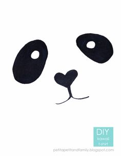 the panda face is made out of black paper and has a heart on it's nose