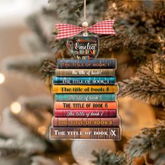 a stack of books ornament hanging from a christmas tree