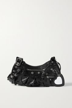 Inspired by classic '00s styles, Balenciaga's 'Le Cagole' bag has a small, slouchy shape and adjustable strap that sits comfortably cross-body or on your shoulder. It's made from black crinkled textured-leather and embellished with metallic studs. The heart mirror will come in particularly handy for touch-ups. Small Bags Fashion, 00s Style, Black Balenciaga, Studded Bag, Balenciaga Bag, Big Fashion, Carry All Bag, Balenciaga City Bag, Fall Fashion Trends