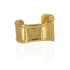 Gold-plated over brass. Adjustable statement cuff. Elegant Adjustable Cuff Rings, Elegant Adjustable Cuff Bracelet With Open Ring, Chic Gold Cuff Bracelet With Polished Finish, Gold Polished Cuff Bracelet, Gold Polished Open Cuff Bracelet, Elegant Adjustable Open Ring Cuff Bracelet, Metal Cuff Bracelet With Polished Finish, Polished Metal Cuff Bracelet, Timeless Gold Open Cuff Bracelet