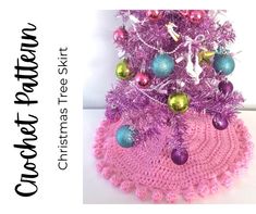 a crocheted christmas tree with ornaments on it's top and the bottom