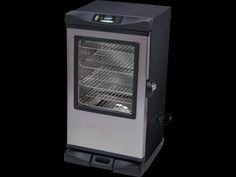 an oven with the door open on a black background