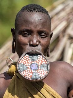 an african man with his nose ring in the shape of a flower