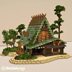 a small house made out of legos in the shape of trees and bushes on an island