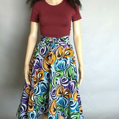 African Women Ankara Print Mid Calf Length Skirt With Side Belt Multi Color Vibrant Print. Flared Handmade Skirt Made With Polycotton Fabric. Length Is 30 Inches Sizes Size 4; Waist 28" Size 6; Waist 30" Size 8; Waist 32" Size 10"; Waist 34" Size 12; Waist 36" Size 14; Waist 38" Size 16; Waist 40" Size 18, Waist 42" Size 20; Waist 44" Multicolor Fitted Long Wrap Skirt, Fitted Multicolor Knee-length Bottoms, Casual Red Flowy Wrap Skirt, Fitted Multicolor Maxi Skirt With Gathered Detail, Fitted Multicolor Gathered Maxi Skirt, Fitted Multicolor Lined Wrap Skirt, Multicolor Relaxed Flared Wrap Skirt, Multicolor Full Skirt With Gathered Details, Red Lined Flared Wrap Skirt