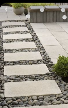 a walkway made out of stones and gravel