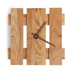 a clock made out of wooden planks on a white background