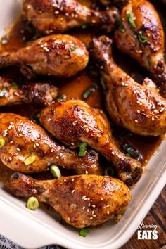 chicken wings with sesame seeds in a white casserole dish