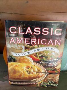 a cookbook sitting on top of a wooden table