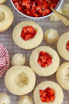 strawberry shortbread muffins on a cooling rack with bowl of strawberries