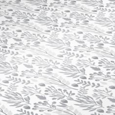 an image of a white and grey wallpaper with leaves on the surface in shades of gray