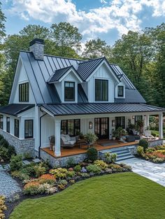 a large white house with a metal roof