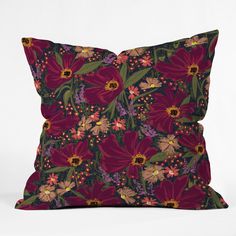 a pillow with red flowers on it