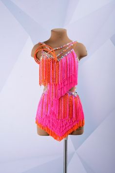 a mannequin with pink and orange fringes on it