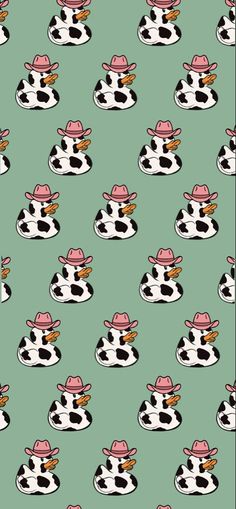 a cow with a pink hat on it's head is sitting in front of a green background