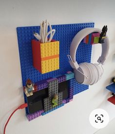 there is a lego wall with headphones on it