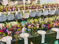 tables and chairs are set up with flower centerpieces for an event or function