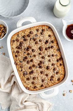 a casserole dish with oatmeal and raisins in it