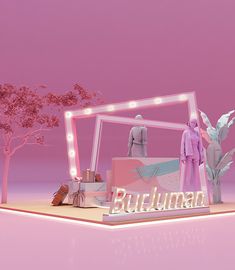 a display with mannequins and lights in front of a pink background that says buluman