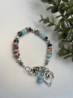 This bracelet  crafted by a natural gemstone snakeskin gemstone 💎  Design; boho. Spacers used sliver plated. Southwestern Silver Bracelets With Natural Stones, Southwestern Silver Bracelets With Gemstone Beads, Southwestern Silver Bracelet With Gemstone Beads, Southwestern Natural Stones Beaded Bracelet Gift, Silver Amazonite Bracelet As Gift, Silver Amazonite Bracelet For Gift, Nickel-free Bohemian Beaded Bracelets For Healing, Bohemian Sterling Silver Beaded Bracelets With Gemstones, Handmade Silver Amazonite Beaded Bracelets