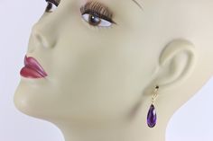 Purple Amethyst simulated teardrop faceted Earrings. Beautiful rich deep purple in color. The french earwires are 14k solid gold or 14k gold filled or sterling silver - you choose. The gemstone size is a large 8x20mm, over 10 carats. The mannequin shows the relative size and how they will hang. Earrings hang 1.4 inches. Simple and lightweight to wear. A great wardrobe basic, they go with almost anything..... Hang Earrings, Amethyst Earrings, Purple Amethyst, Purple Gold, Nostril Hoop Ring, Deep Purple, Rich Color, Solid Gold, Gold Filled