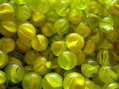 close up view of yellow and green glass beads