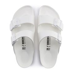 The Arizona EVA Slide Sandal in White for Men from Birkenstock. The Birkenstock Arizona is a total classic, just like the original cork sandal. But this one's made from EVA, a super light and super bendy material. Plus, the top-notch EVA has been checked for yucky stuff and has a ton of great qualities. It's waterproof, so light you won't even feel it, and easy to wash. Anatomically shaped Birkenstock footbed in EVA Upper/lining/sole: one-piece EVA Details: waterproof, washable, ultra lightweight Made in Germany Birkenstock Flip Flops, Fuzzy Heels, Birkenstock Arizona Eva, Arizona Eva, Womens Casual Boots, Two Strap Sandals, Over The Calf Socks, Colored Sandals, Cork Sandals