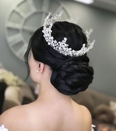 a woman wearing a tiara in her hair