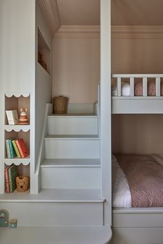 there is a bunk bed with stairs to the top and bottom beds on both sides