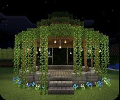 a small gazebo in the middle of a garden at night