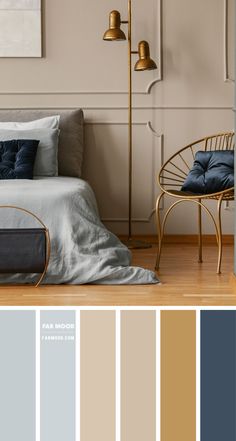 a bedroom with beige walls, blue and gray bedding, gold floor lamp, and chair