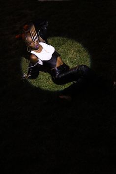 a person laying on the ground in the dark