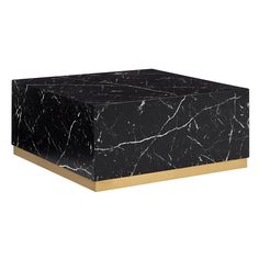 a black and white marble box with gold trim