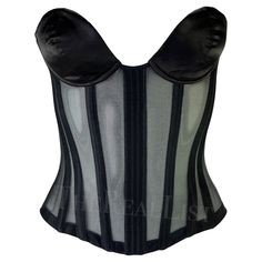 Presenting a truly fabulous black Thierry Mugler by Mr. Pearl corset, designed by Manfred Mugler. From the late 1990s, this form-fitting corset features black satin boning with very sheer black fabric between each panel. Created with a wide sweetheart neckline, this ultra-sexy corset is made complete with black satin-covered cups and a lace-up closure at the back. This lingerie-style top is a must-have addition to any Thierry Mugler lover's collection. Approximate measurements: Size - removed To Mugler Corset Top, Mr Pearl Corset, Thierry Mugler Corset, Mugler Corset, Pearl Corset, Mr Pearl, Black Corset Top, Satin Noir, Thierry Mugler